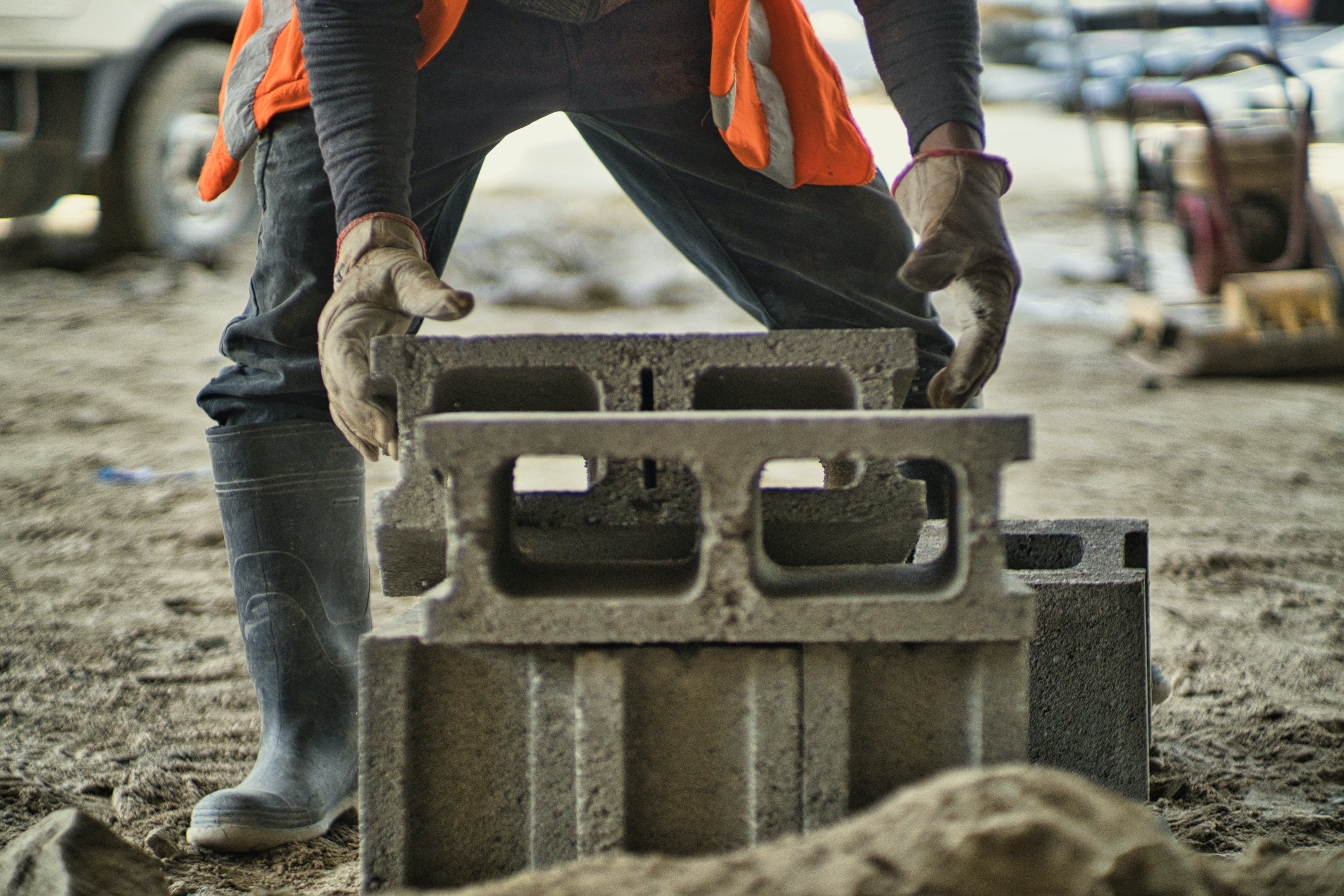 construction worker laying building blocks